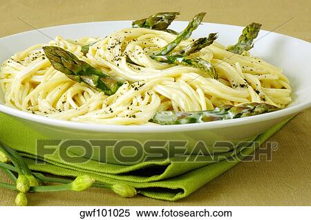 Close-up of a bowl of spaghetti with asparagus View Large Photo Image Stock Photography - Close-up of a bowl of spaghetti with asparagus. Fotosearch