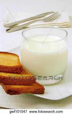 Close-up of a glass of milk and toast View Large Photo Image Stock Photo - Close-up of a glass of milk and toast. Fotosearch
