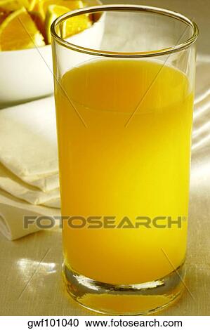 Close-up of a glass of orange juice View Large Photo Image Stock Image - Close-up of a glass of orange juice. Fotosearch