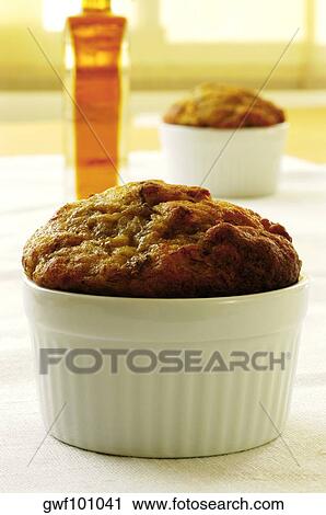 Stock Image - Close-up of a muffin in a bowl. Fotosearch