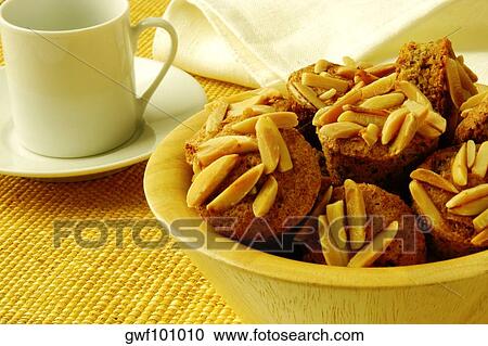 Stock Image - Close-up of almond muffins in a bowl. Fotosearch