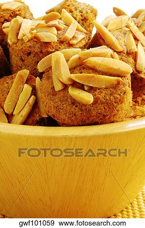 Close-up of almond muffins in a bowl View Large Photo Image Stock Photo - Close-up of almond muffins in a bowl. Fotosearch