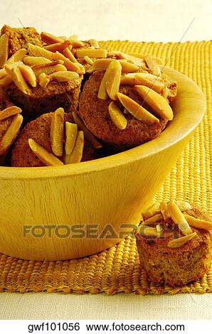 Close-up of almond muffins in a bowl View Large Photo Image Stock Photograph - Close-up of almond muffins in a bowl. Fotosearch