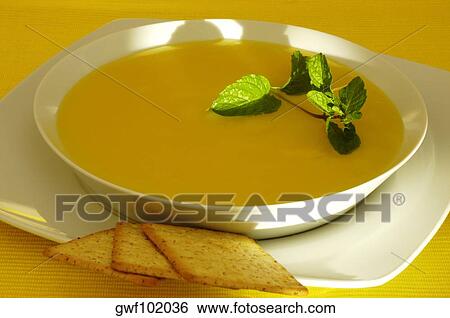 Close-up of a bowl of soup and crackers View Large Photo Image Stock Photograph - Close-up of a bowl of soup and crackers. Fotosearch