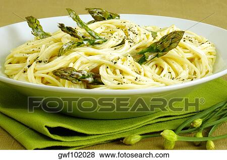 Stock Photo - Close-up of a bowl of spaghetti with asparagus. Fotosearch