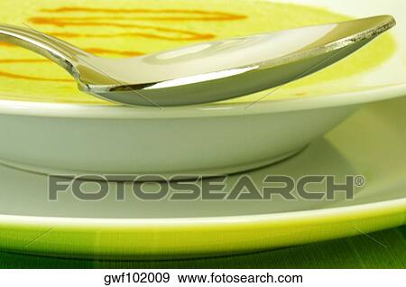Close-up of a spoon in a bowl View Large Photo Image Stock Photo - Close-up of a spoon in a bowl. Fotosearch