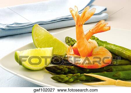 Close-up of prawns and asparagus in a plate View Large Photo Image Stock Photo - Close-up of prawns and asparagus in a plate. Fotosearch