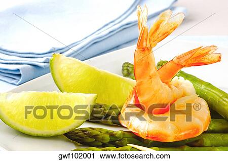 Close-up of prawns and lemon slices in a plate View Large Photo Image Stock Image - Close-up of prawns and lemon slices in a plate. Fotosearch