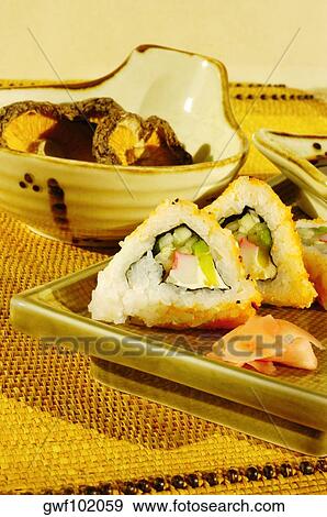 Close-up of sushi on a serving tray View Large Photo Image Stock Photo - Close-up of sushi on a serving tray. Fotosearch