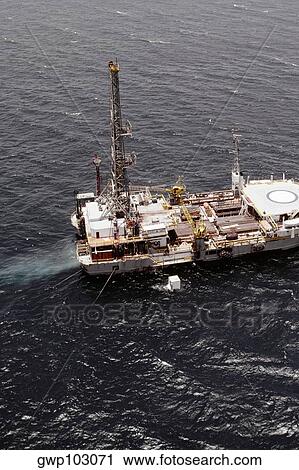 Stock Image - Aerial view of an oil drilling ship in the sea. Fotosearch