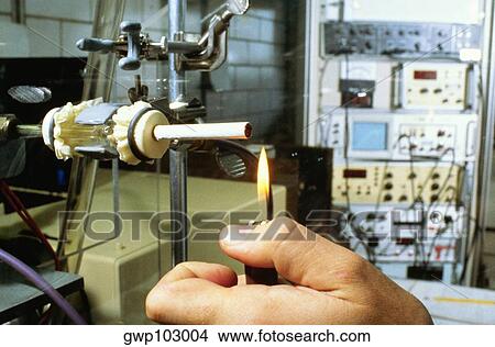 Close-up of a person's hand lighting a cigarette on a testing machine in a manufacturing plant, Richmond, Virginia, USA View Large Photo Image Picture - Close-up of a person's hand lighting a cigarette on a testing machine in a manufacturing plant, Richmond, Virginia, USA. Fotosearch