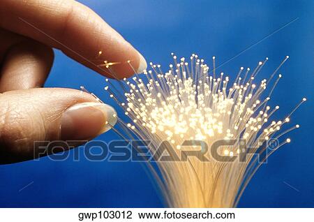 Close-up of a person's hand touching fiber optic cables View Large Photo Image Stock Image - Close-up of a person's hand touching fiber optic cables. Fotosearch