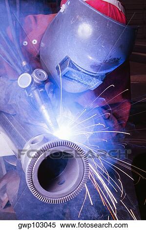 Close-up of a welder welding a pipe View Large Photo Image Stock Photography - Close-up of a welder welding a pipe. Fotosearch