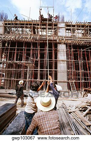 Construction workers working at a construction site, Siam City, Thailand View Large Photo Image Stock Photo - Construction workers working at a construction site, Siam City, Thailand. Fotosearch