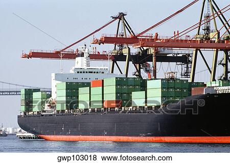 Container ship being unloaded at a dock View Large Photo Image Stock Photo - Container ship being unloaded at a dock. Fotosearch