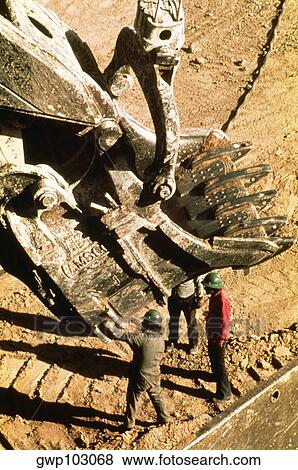 Stock Photo - High angle view of a earth mover machine at a copper mine, Cuajone, Peru. Fotosearch