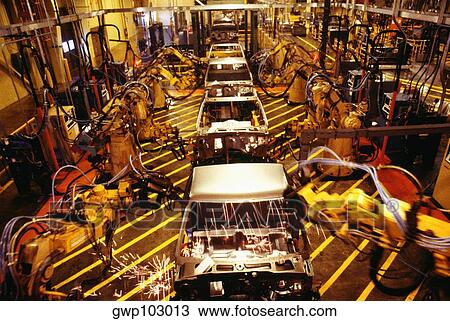 High angle view of robots at work in a plant, GMC Truck Plant, Michigan, USA View Large Photo Image Stock Image - High angle view of robots at work in a plant, GMC Truck Plant, Michigan, USA. Fotosearch