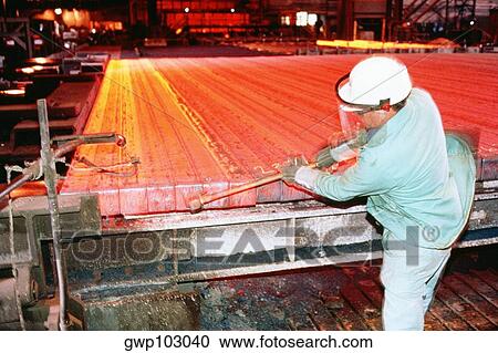 Manual worker working in a factory View Large Photo Image Stock Image - Manual worker working in a factory. Fotosearch