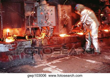 Side profile of a manual worker working in a steel plant View Large Photo Image Stock Photograph - Side profile of a manual worker working in a steel plant. Fotosearch