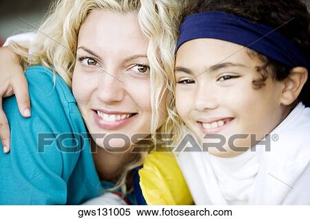 Close-up of a mother and her daughter smiling View Large Photo Image Stock Photography - Close-up of a mother and her daughter smiling. Fotosearch