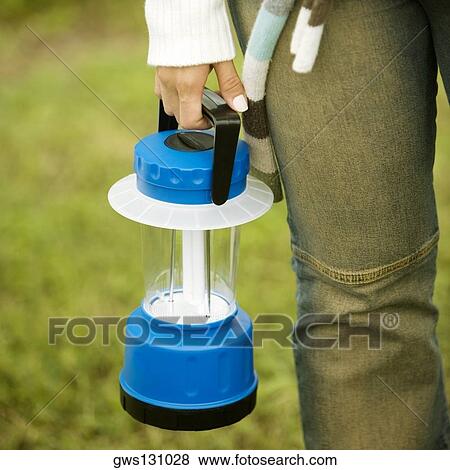 Close-up of a woman's hand holding a lantern View Large Photo Image Stock Photo - Close-up of a woman's hand holding a lantern. Fotosearch
