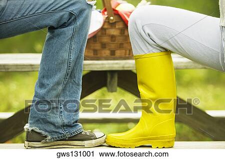 Stock Image - Close-up of two human legs. Fotosearch