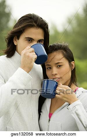 Stock Photo - Close-up of a young couple drinking coffee. Fotosearch