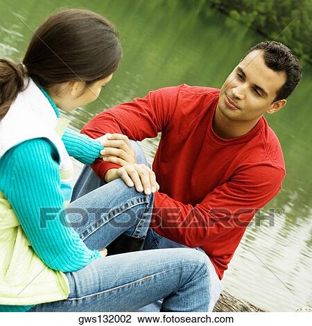Close-up of a young man holding a young woman's hand View Large Photo Image Stock Image - Close-up of a young man holding a young woman's hand. Fotosearch