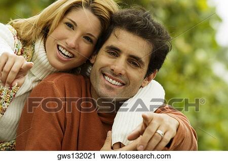 Portrait of a mid adult man and a young woman pointing forward View Large Photo Image Stock Image - Portrait of a mid adult man and a young woman pointing forward. Fotosearch