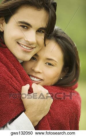 Portrait of a young couple smiling View Large Photo Image Stock Image - Portrait of a young couple smiling. Fotosearch