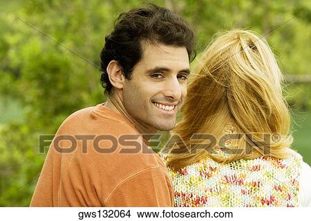 Side profile of a mid adult man and a young woman View Large Photo Image Picture - Side profile of a mid adult man and a young woman. Fotosearch