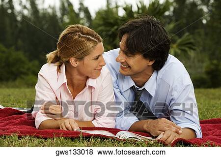 Close-up of a businesswoman and a businessman looking at each other View Large Photo Image Stock Photo - Close-up of a businesswoman and a businessman looking at each other. Fotosearch
