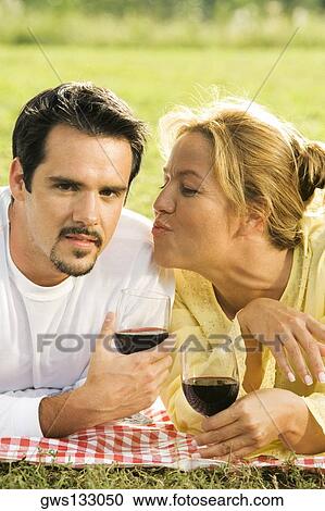 Close-up of a young woman puckering her lips at a mature man View Large Photo Image Stock Image - Close-up of a young woman puckering her lips at a mature man. Fotosearch