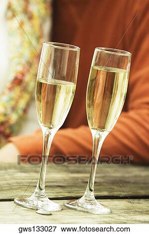 Close-up of two champagne flutes View Large Photo Image Stock Photo - Close-up of two champagne flutes. Fotosearch