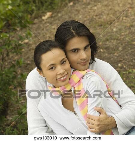 Portrait of a young couple smiling View Large Photo Image Stock Image - Portrait of a young couple smiling. Fotosearch