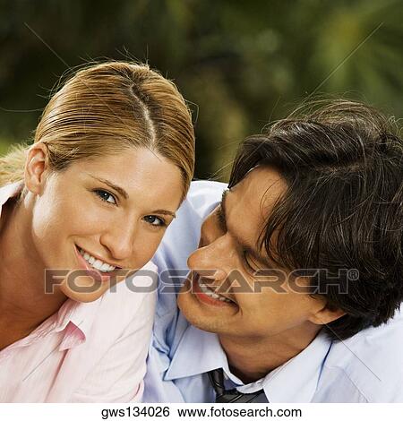 Stock Photograph - Portrait of a businesswoman and a businessman smiling. Fotosearch