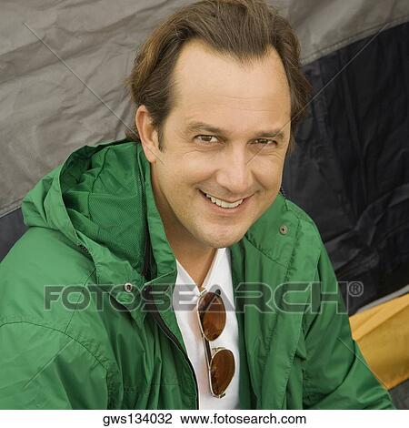 Portrait of a mature man smiling View Large Photo Image Stock Image - Portrait of a mature man smiling. Fotosearch