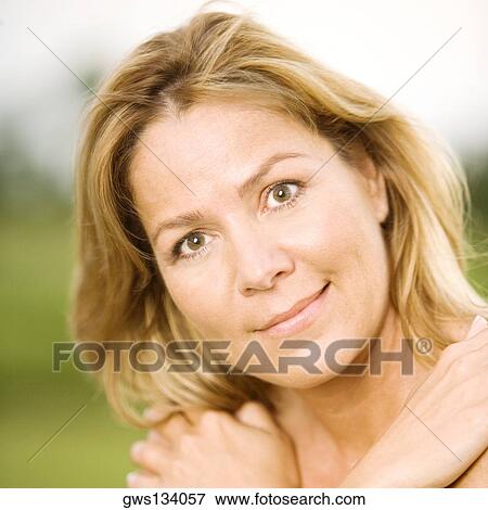 Portrait of a mature woman with her arms folded View Large Photo Image Stock Photo - Portrait of a mature woman with her arms folded. Fotosearch