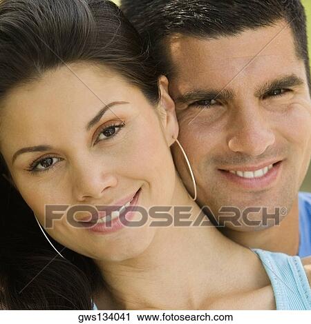Portrait of a mid adult man and a young woman smiling View Large Photo Image Stock Image - Portrait of a mid adult man and a young woman smiling. Fotosearch