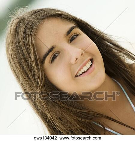 Stock Image - Portrait of a teenage girl smiling. Fotosearch