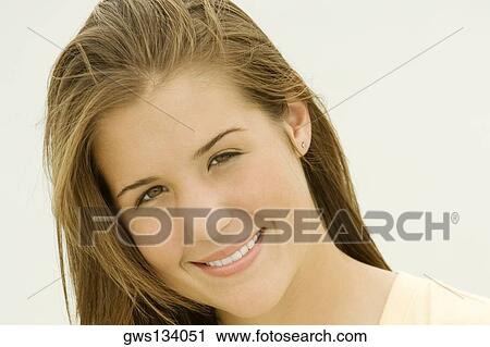 Portrait of a teenage girl smiling View Large Photo Image Stock Image - Portrait of a teenage girl smiling. Fotosearch