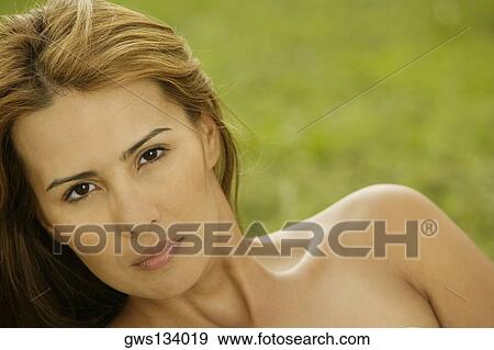 Portrait of a young woman looking serious View Large Photo Image Stock Photo - Portrait of a young woman looking serious. Fotosearch