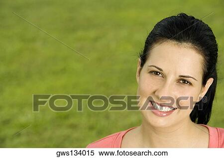 Portrait of a young woman smiling View Large Photo Image Stock Photography - Portrait of a young woman smiling. Fotosearch