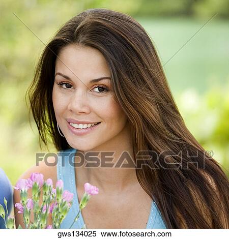 Portrait of a young woman smiling View Large Photo Image Stock Photography - Portrait of a young woman smiling. Fotosearch