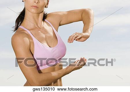 Stock Image - Close-up of a mid adult woman practicing martial arts. Fotosearch