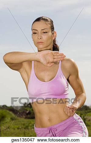 Close-up of a mid adult woman practicing martial arts View Large Photo Image Stock Photo - Close-up of a mid adult woman practicing martial arts. Fotosearch
