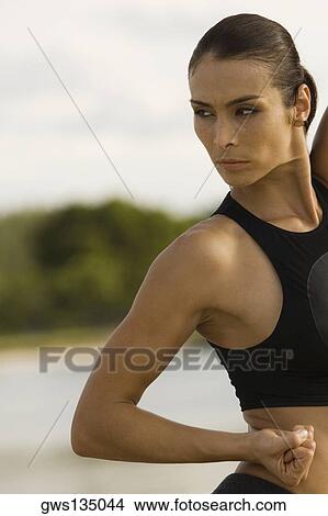 Close-up of a young woman exercising View Large Photo Image Picture - Close-up of a young woman exercising. Fotosearch