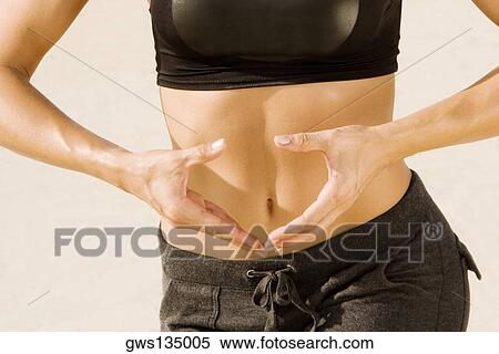 Mid section view of a young woman practicing martial arts View Large Photo Image Stock Photography - Mid section view of a young woman practicing martial arts. Fotosearch