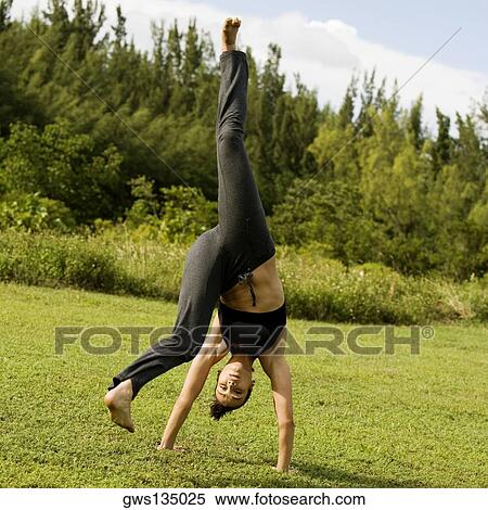 Portrait of a young woman practicing martial arts View Large Photo Image Stock Photography - Portrait of a young woman practicing martial arts. Fotosearch