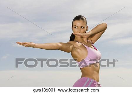 Side profile of a mid adult woman exercising View Large Photo Image Stock Image - Side profile of a mid adult woman exercising. Fotosearch